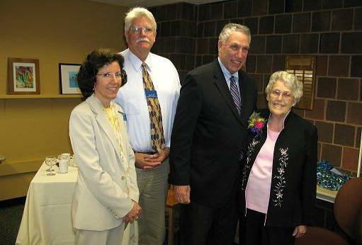 Betty Lane posing with colleagues upon retirement